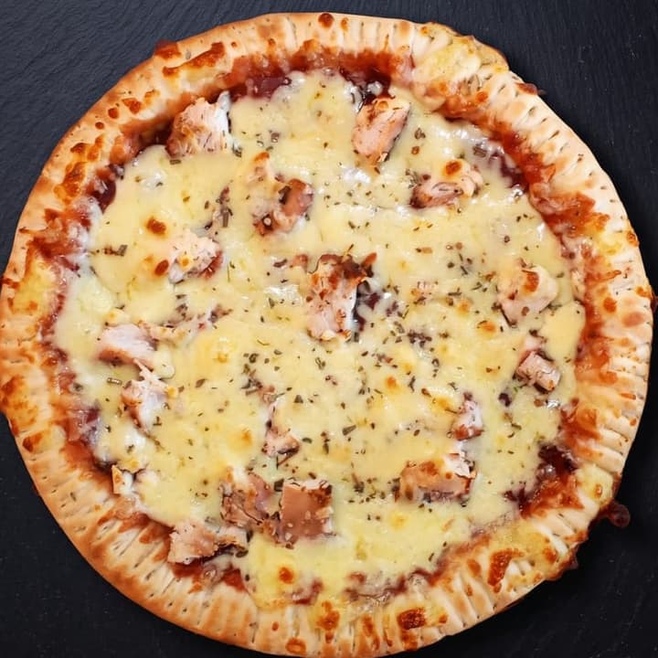 An oven-baked Queso pizza, viewed from above